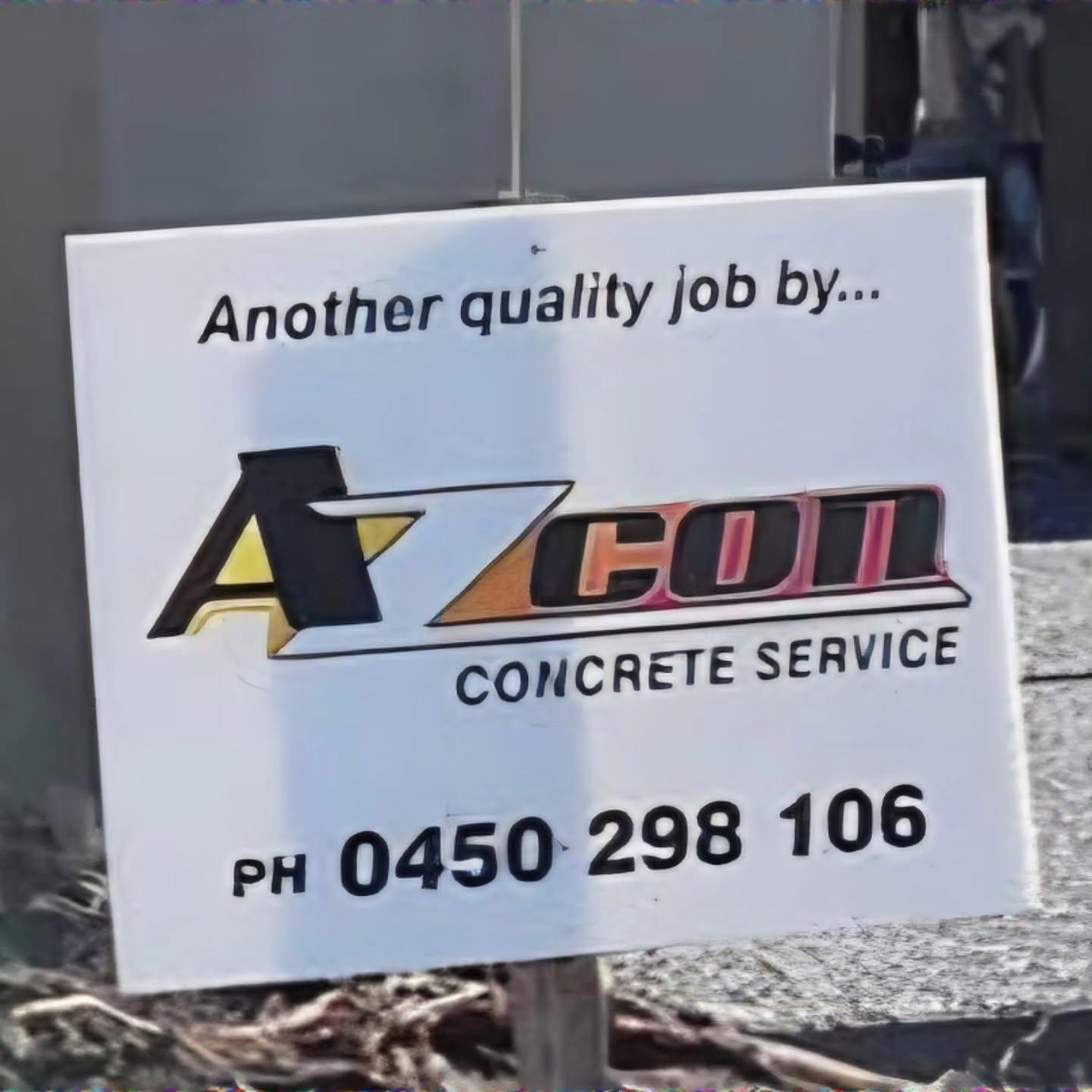 Azcon job site sign reading Another quality job by Azcon Concrete Service